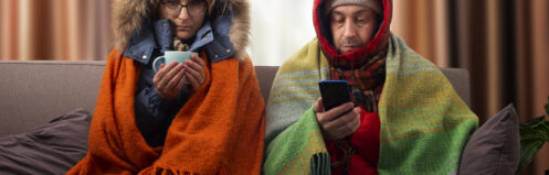 Couple in parkas, heater shut down